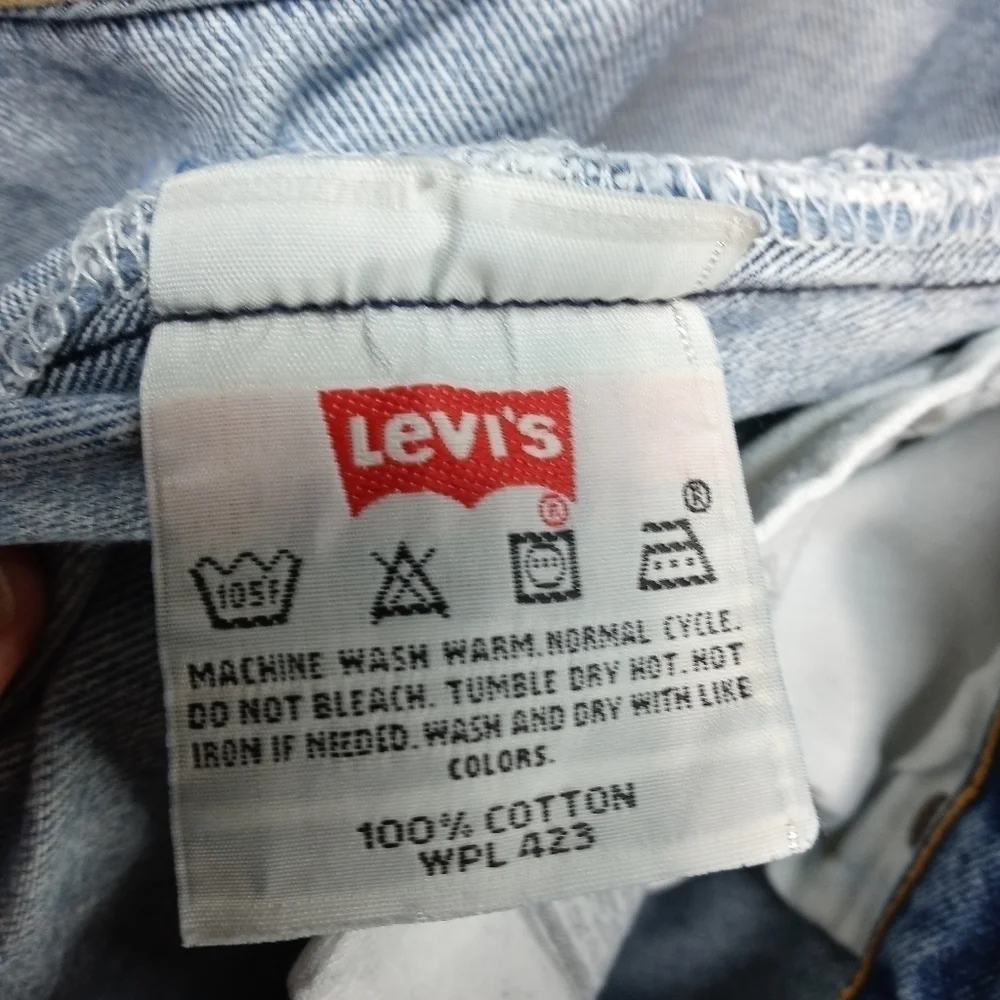 Levis 501XX men's button fly blue jeans. Sz 38x34.tear in seat. See last pic. M2